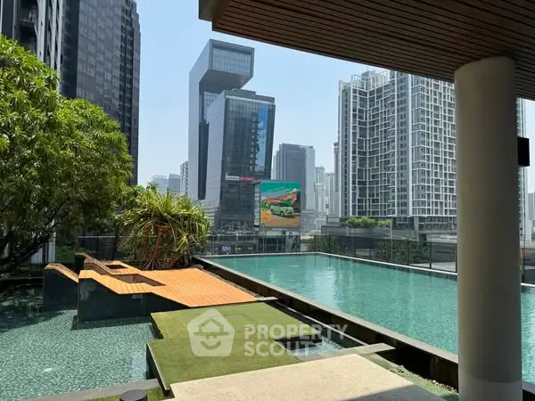 Luxurious rooftop pool with stunning cityscape views in modern urban setting.