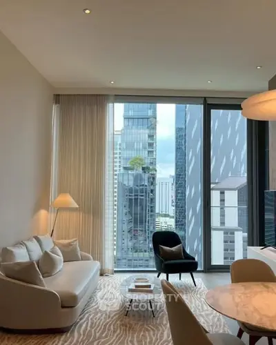 Luxurious living room with stunning city view through floor-to-ceiling windows.