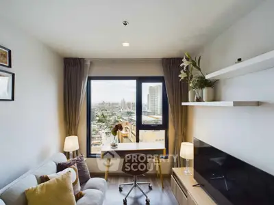 Modern living room with city view, stylish decor, and natural light