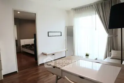 Modern study room with natural light and wooden flooring