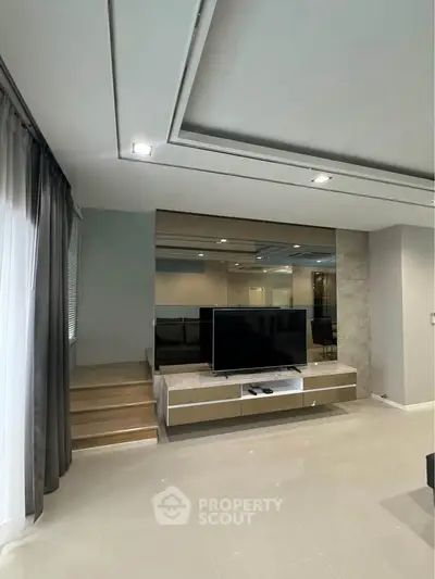 Modern living room with sleek TV setup and elegant decor