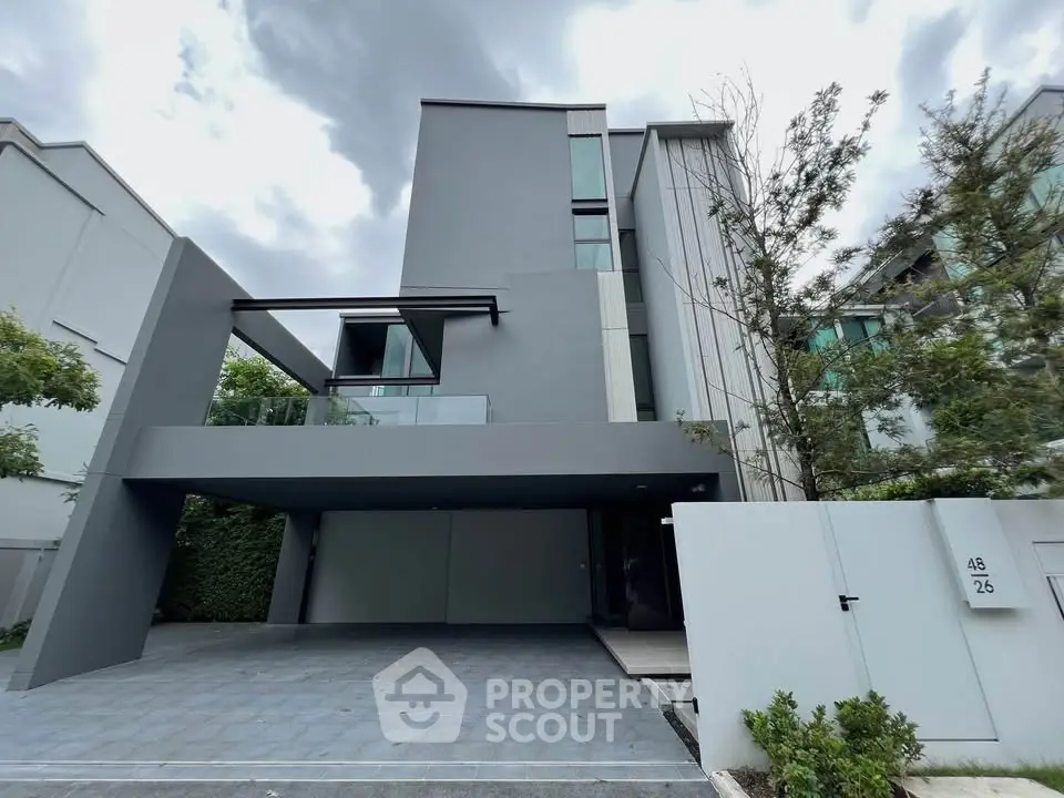 Modern three-story townhouse with sleek design and spacious driveway