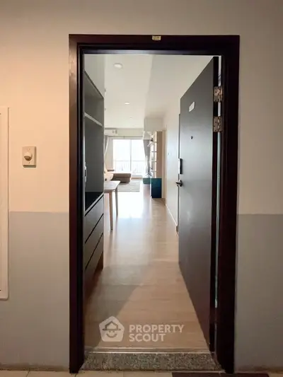 Inviting entrance to a modern apartment with open layout and natural light.