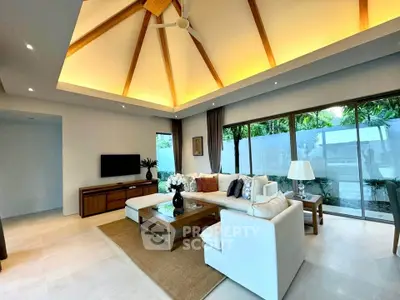 Luxurious living room with high ceiling and modern decor in tropical villa