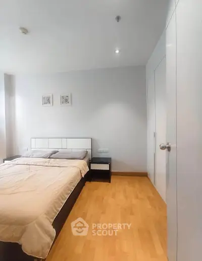 Spacious bedroom with modern decor and ample natural light