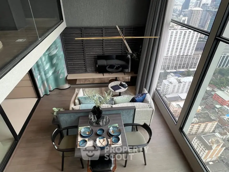 Luxurious high-rise living room with stunning city view and elegant dining setup.