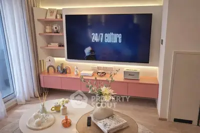 Stylish modern living room with large TV and elegant decor