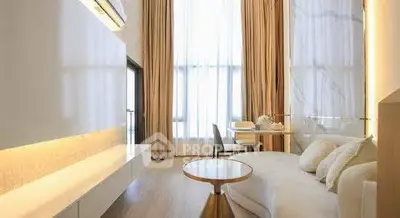 Luxurious living room with high ceilings and elegant decor in modern apartment.