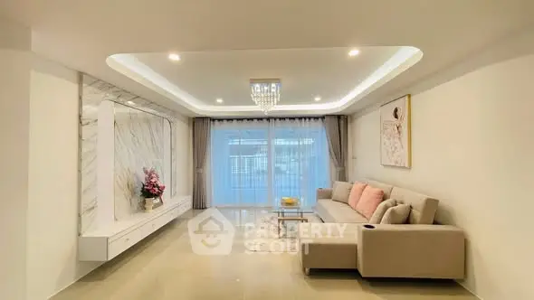 Elegant living room with modern decor and large sofa, perfect for relaxation.