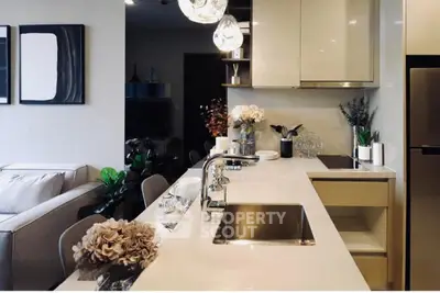 Modern open-layout kitchen with sleek countertops and stylish decor