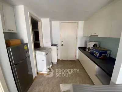 Modern kitchen with sleek appliances and ample storage space