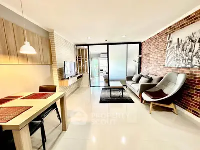 Modern living room with stylish brick wall and cozy seating area