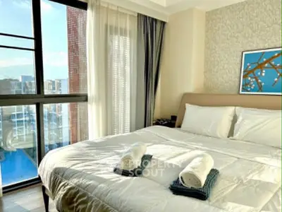 Luxurious bedroom with large window and elegant decor in modern apartment