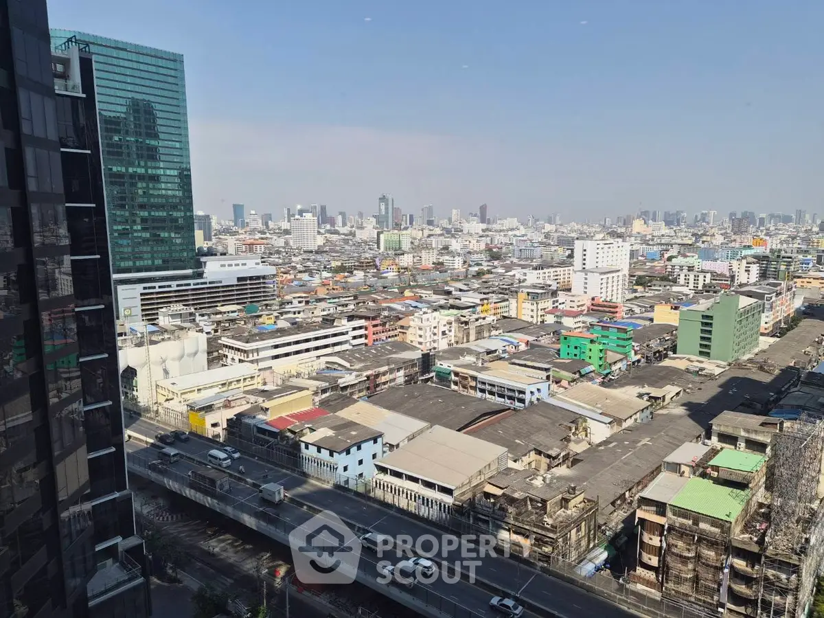 Stunning cityscape view from high-rise building showcasing urban skyline and vibrant city life.