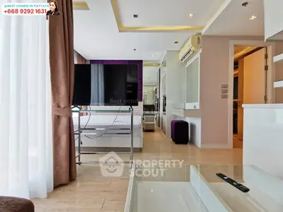 Modern condo living room with sleek design and large TV in Pattaya