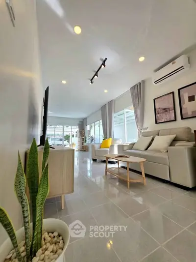 Spacious modern living room with elegant decor and natural light