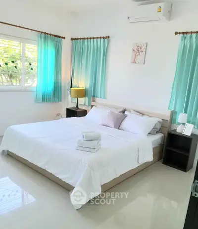 Bright and airy bedroom with modern decor and natural light