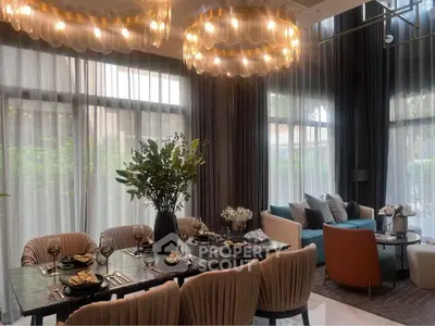 Luxurious dining and living area with elegant lighting and modern decor