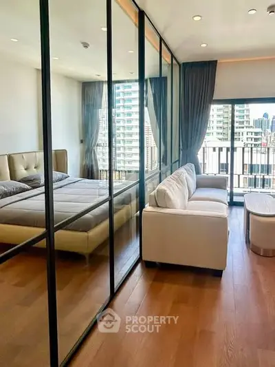 Modern bedroom with glass partition and city view balcony