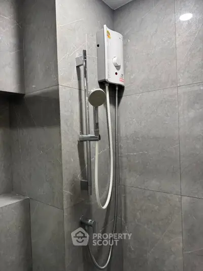 Modern bathroom with sleek shower and water heater installation