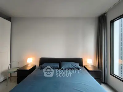 Modern bedroom with sleek design, featuring a comfortable bed and ambient lighting, perfect for relaxation.