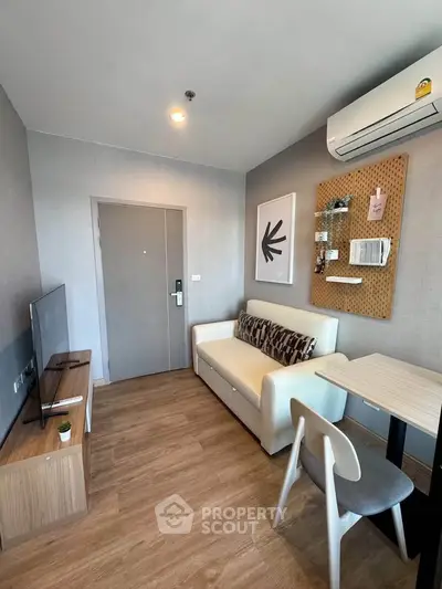Modern living room with stylish decor and air conditioning in a cozy apartment.