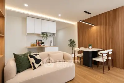 Modern living room with cozy beige sofa and stylish dining area