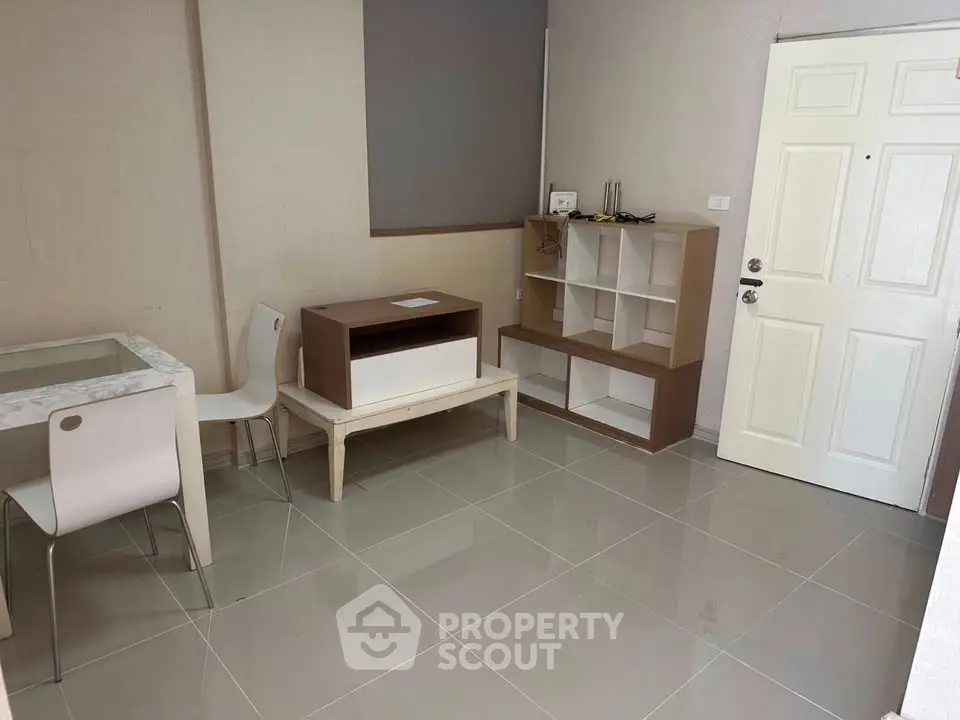 Modern minimalist living room with sleek furniture and tiled flooring