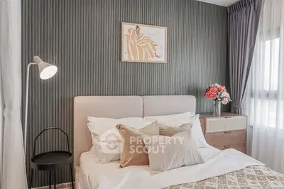 Elegant bedroom with stylish decor and natural light