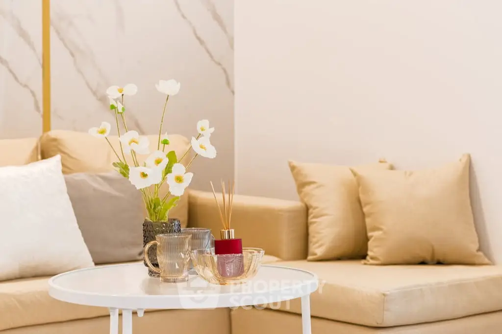 Elegant living room with cozy beige sofa and stylish decor accents
