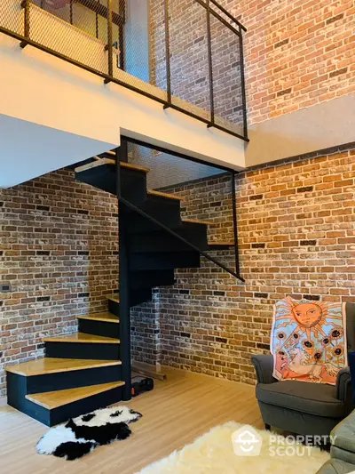 Stylish loft interior with modern staircase and exposed brick walls