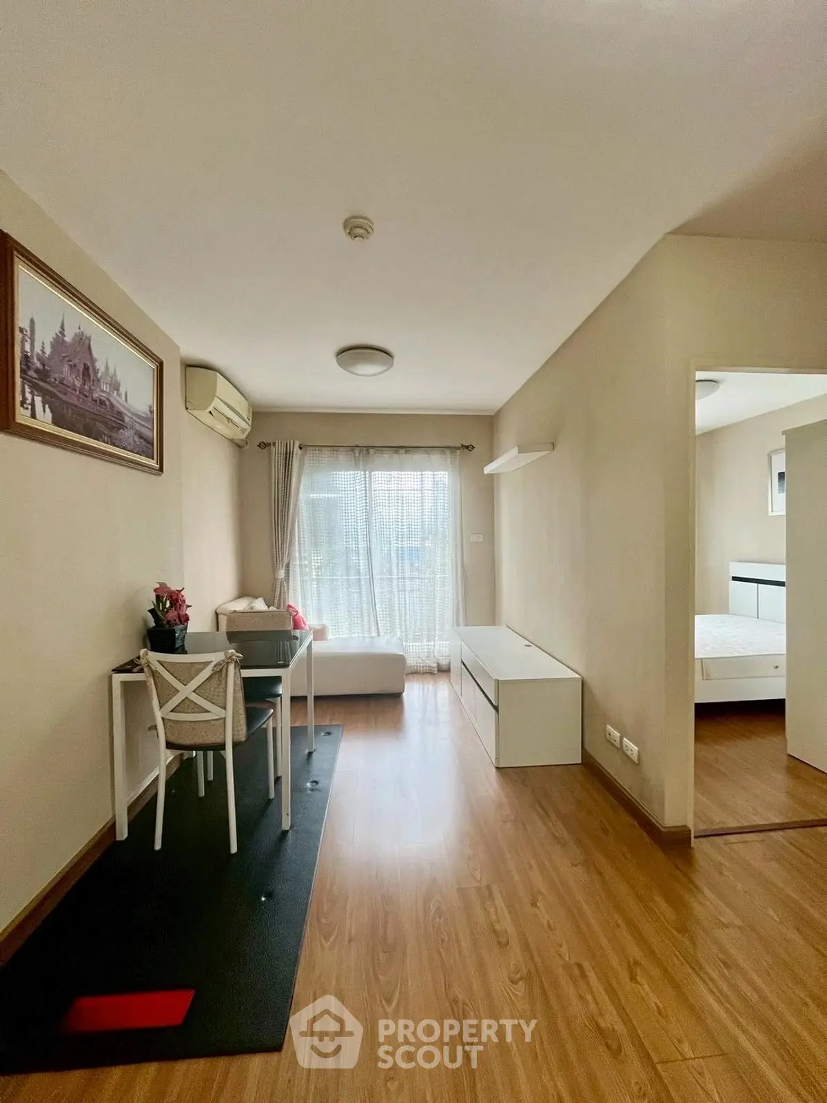 Modern living room with wooden flooring and natural light