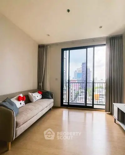 Bright living room with city view and cozy sofa in modern apartment