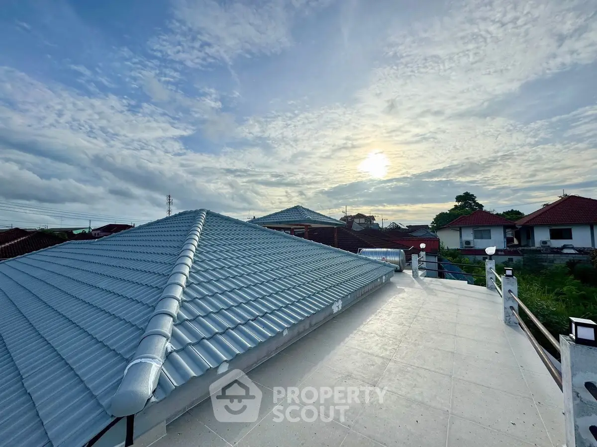 Stunning rooftop view with modern tiled roof under a picturesque sky.