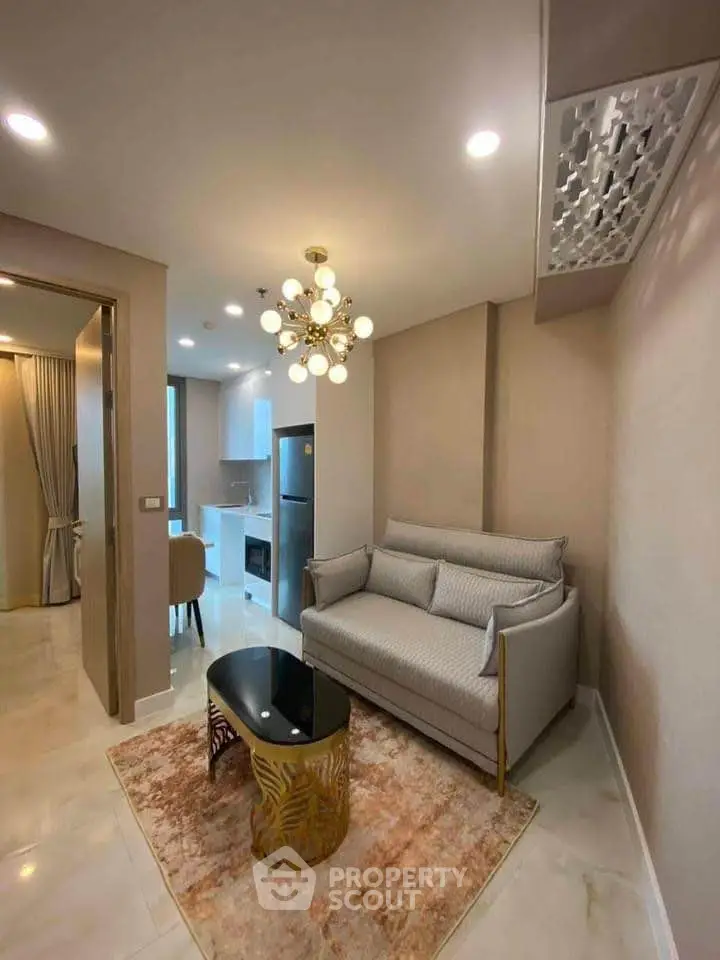 Modern living room with elegant decor and open kitchen layout in luxury apartment