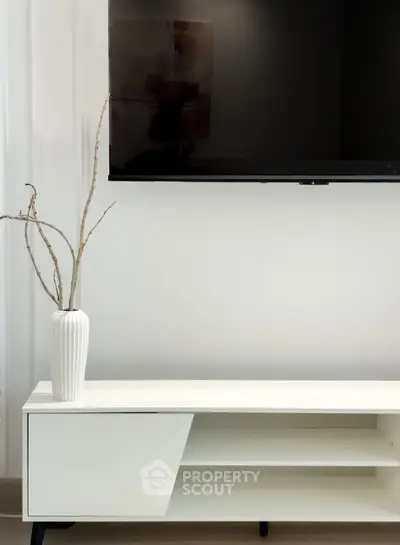 Modern living room with sleek TV setup and minimalist decor