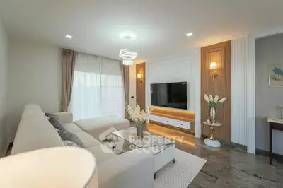Luxurious modern living room with elegant decor and large sectional sofa