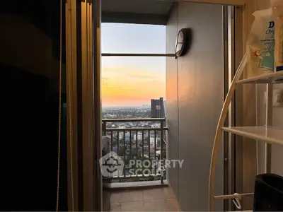 Stunning balcony view at sunset with cityscape in the background, perfect for relaxation.