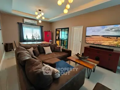 Spacious living room with modern decor and large sectional sofa