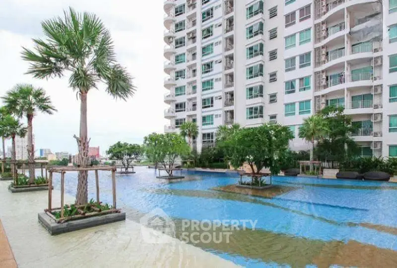 Luxurious high-rise building with stunning pool and lush greenery