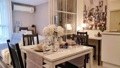 Stylish open-plan living and dining area with modern decor and cityscape artwork.