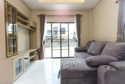 Spacious living room with modern sofa and large window view