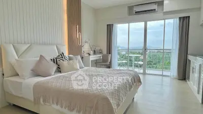 Luxurious bedroom with modern decor and stunning balcony view