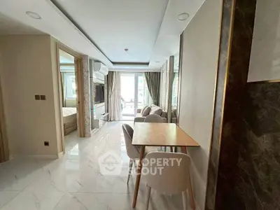 Modern apartment interior with dining area and view into bedroom