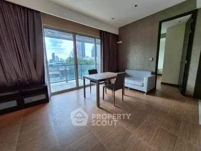Spacious living room with modern decor and city view balcony