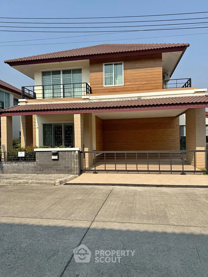 Charming two-story house with modern design and spacious driveway in a serene neighborhood.