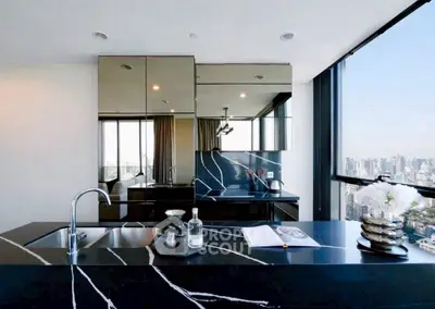 Luxurious modern kitchen with stunning city view and sleek black countertops.