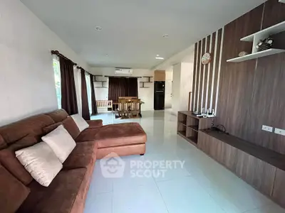 Spacious living room with modern decor and brown sectional sofa