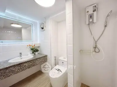 Modern bathroom with sleek fixtures and elegant lighting