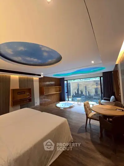 Luxurious bedroom with unique ceiling design and private jacuzzi overlooking a scenic view.
